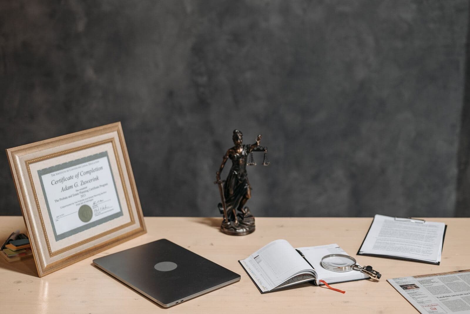 Lawyer reviewing documents at a desk during a consultation